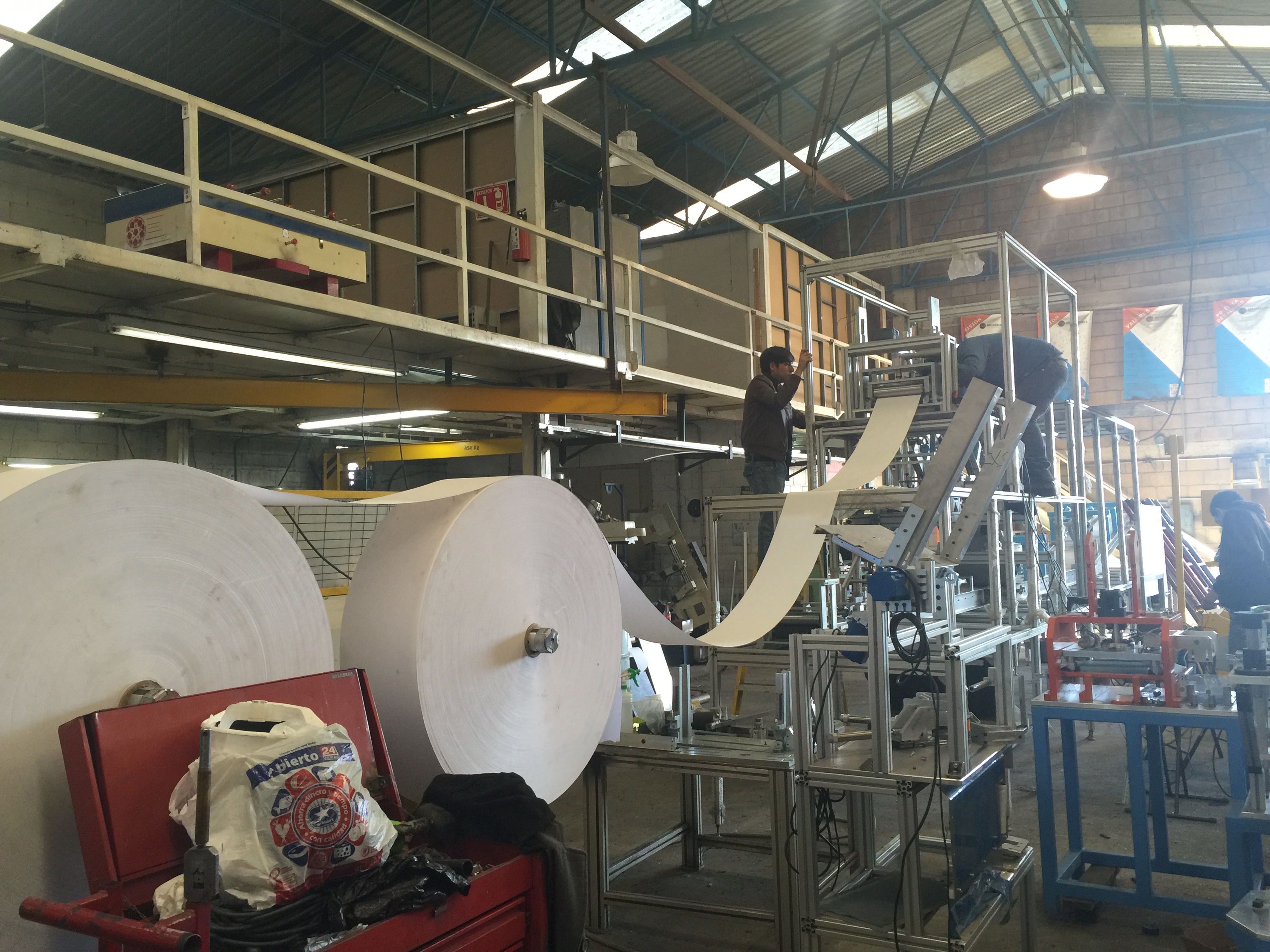 Metal fabrication workshop with welding equipment and steel structures